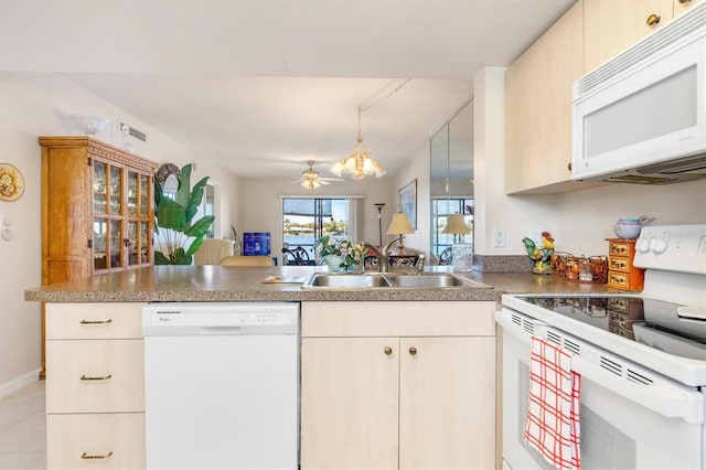 kitchen featuring sink, kitchen peninsula, white appliances, light tile patterned flooring, and ceiling fan with notable chandelier