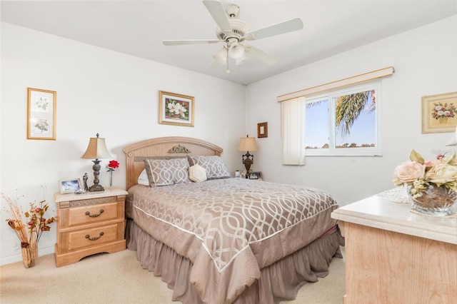 bedroom featuring light carpet and ceiling fan