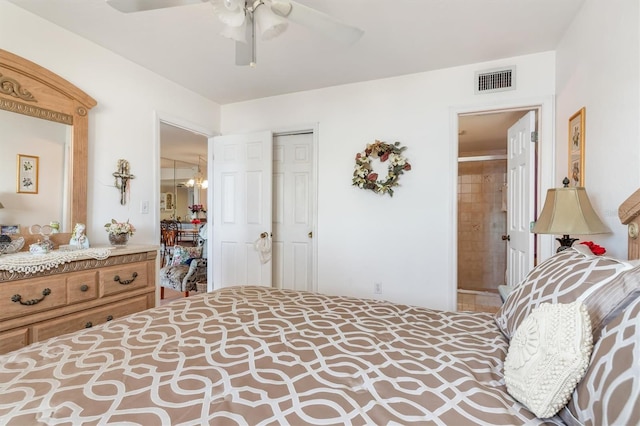 bedroom with ceiling fan, a closet, and ensuite bath