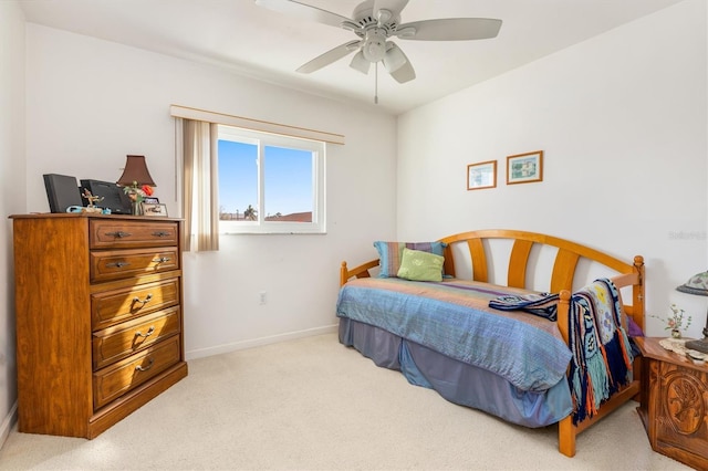 bedroom with light colored carpet and ceiling fan