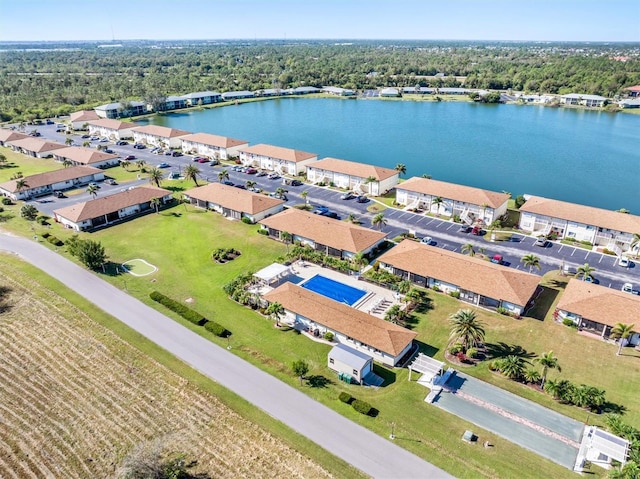 birds eye view of property featuring a water view