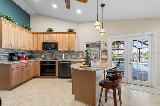 kitchen with light stone counters, tasteful backsplash, vaulted ceiling, and black appliances