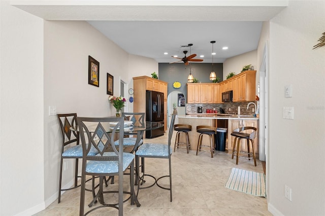 dining area featuring ceiling fan