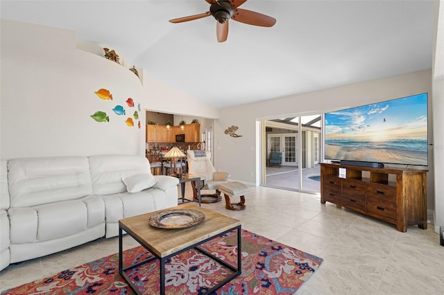 living room with light tile patterned floors, ceiling fan, and lofted ceiling