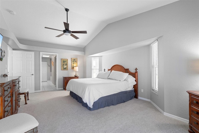 carpeted bedroom with vaulted ceiling and ceiling fan