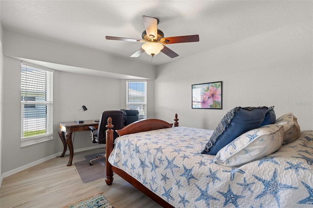 bedroom featuring ceiling fan and light hardwood / wood-style floors