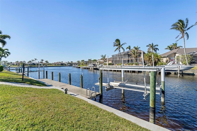 view of dock featuring a yard and a water view