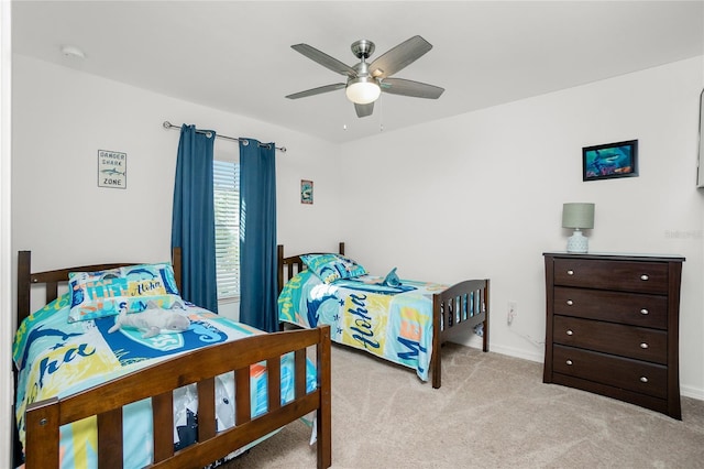 bedroom featuring ceiling fan and light colored carpet