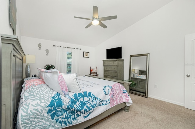 bedroom with ceiling fan, high vaulted ceiling, and light carpet