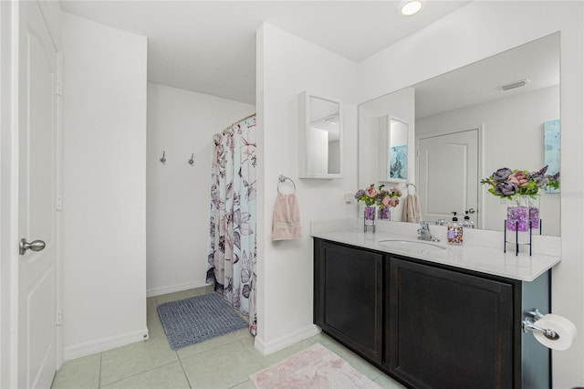 bathroom with tile patterned floors, vanity, and a shower with curtain