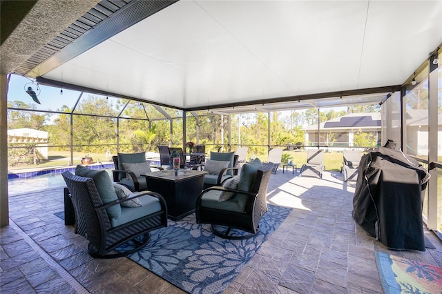 view of patio featuring outdoor lounge area and glass enclosure