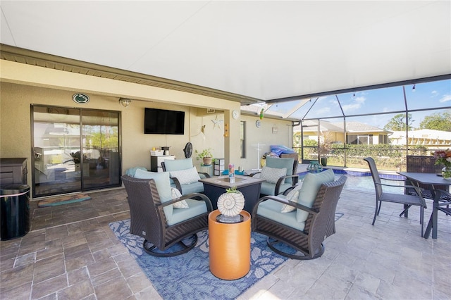 view of patio with outdoor lounge area, a pool, and glass enclosure