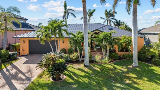 view of front facade with a garage and a front yard