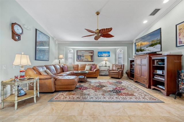 living room with vaulted ceiling, ceiling fan, and ornamental molding