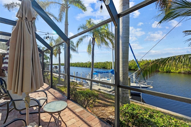 unfurnished sunroom with a water view