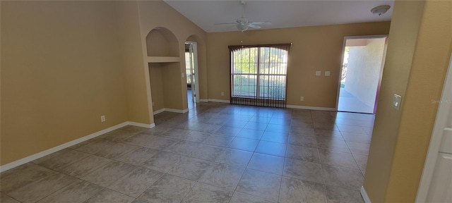 unfurnished room with ceiling fan, light tile patterned floors, and vaulted ceiling