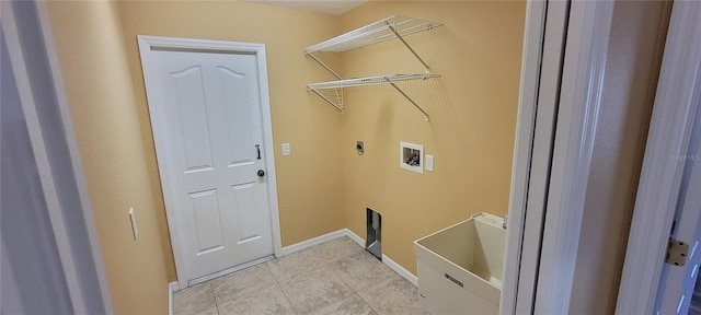 laundry room featuring washer hookup, electric dryer hookup, and light tile patterned flooring