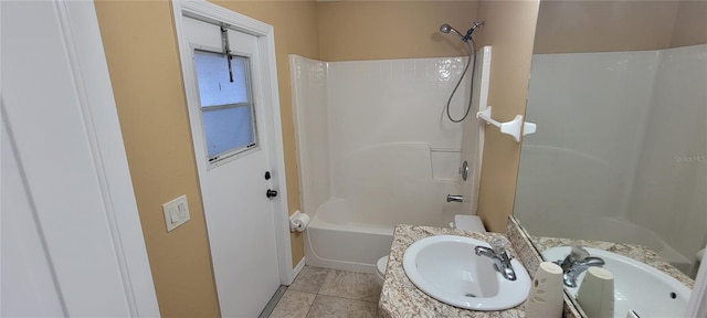 full bathroom featuring toilet, vanity, tile patterned floors, and shower / bathtub combination