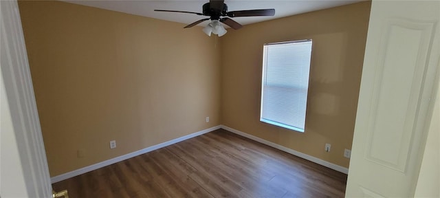 empty room with hardwood / wood-style floors and ceiling fan