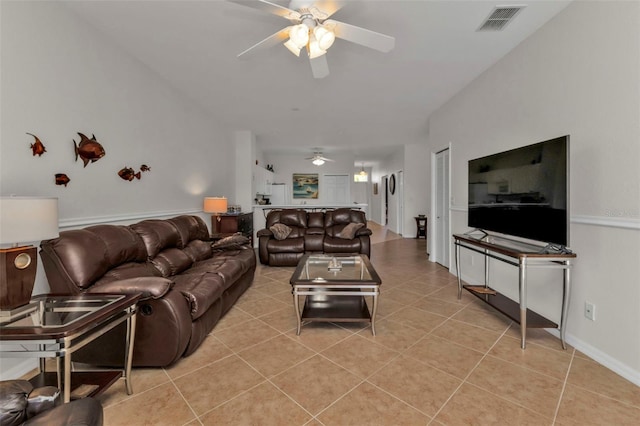 living room featuring ceiling fan and light tile patterned flooring