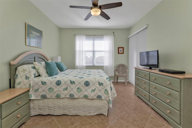 bedroom with ceiling fan and light tile patterned flooring