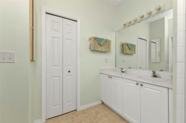 bathroom with tile patterned floors and vanity