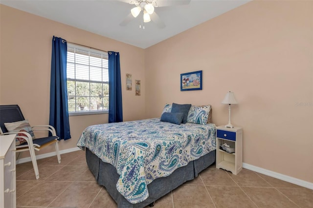 tiled bedroom featuring ceiling fan