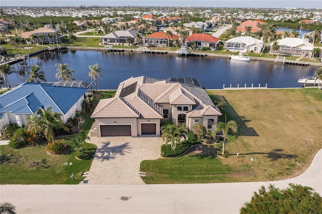 birds eye view of property with a water view