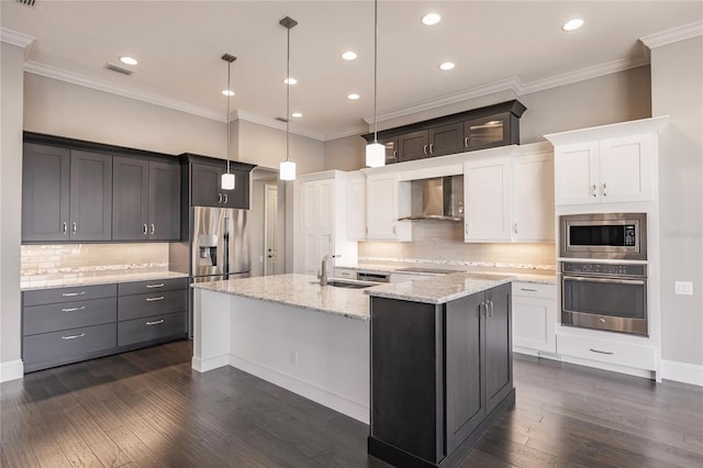 kitchen featuring white cabinets, dark hardwood / wood-style flooring, stainless steel appliances, and wall chimney range hood