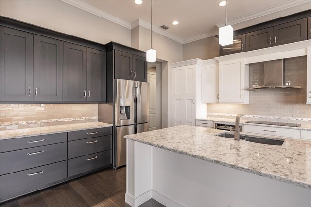 kitchen with stainless steel fridge with ice dispenser, dark hardwood / wood-style floors, white cabinetry, and hanging light fixtures