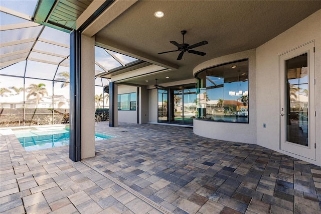 view of patio / terrace with ceiling fan, a fenced in pool, and glass enclosure