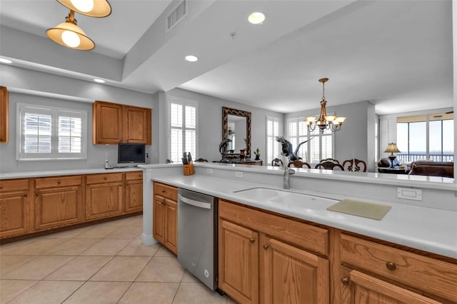 kitchen with sink, hanging light fixtures, stainless steel dishwasher, light tile patterned floors, and a chandelier