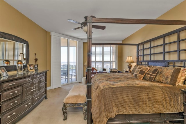 bedroom featuring access to outside, ceiling fan, and light colored carpet