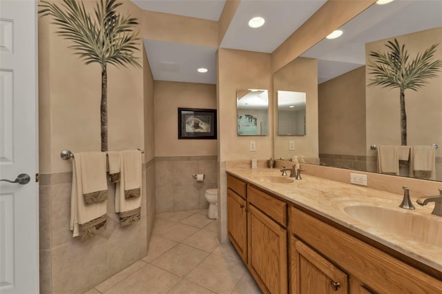 bathroom featuring tile patterned flooring, vanity, and toilet