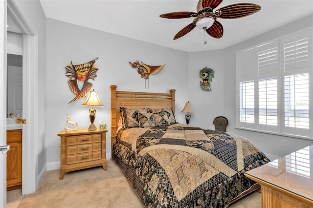 bedroom featuring ceiling fan and light carpet