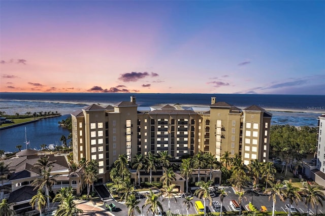 outdoor building at dusk featuring a water view