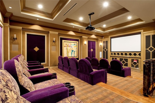 home theater room featuring light colored carpet and crown molding