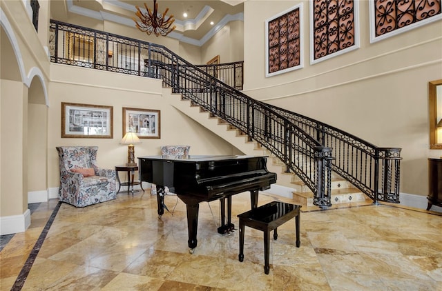 miscellaneous room with coffered ceiling, a towering ceiling, ornamental molding, and a notable chandelier