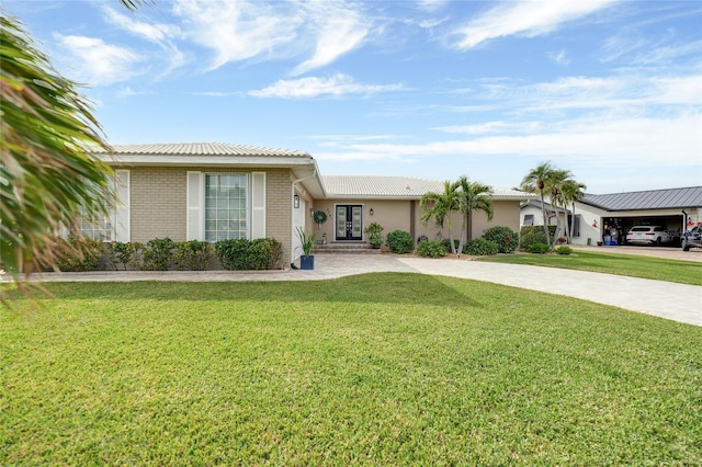 ranch-style house featuring a front lawn