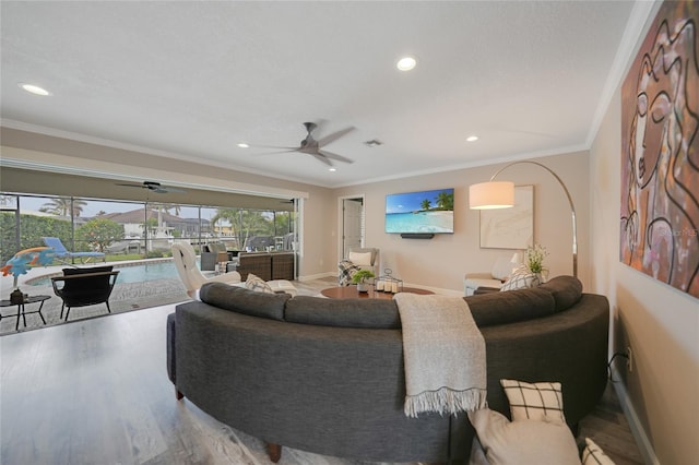 living room featuring hardwood / wood-style floors and crown molding