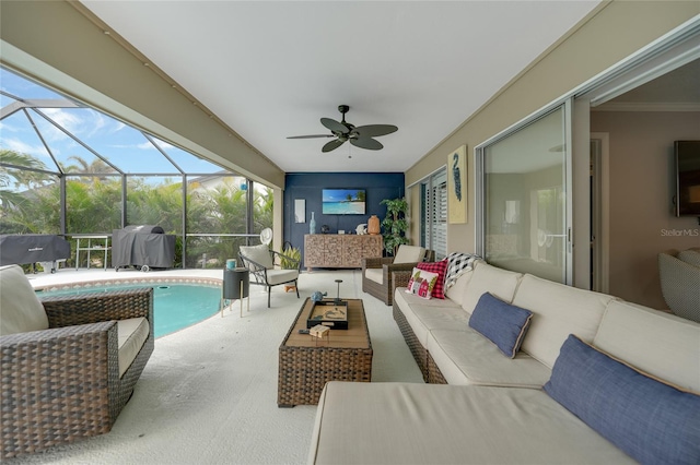 view of patio with glass enclosure, ceiling fan, and an outdoor hangout area