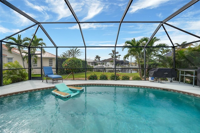 view of pool featuring a lanai and a patio