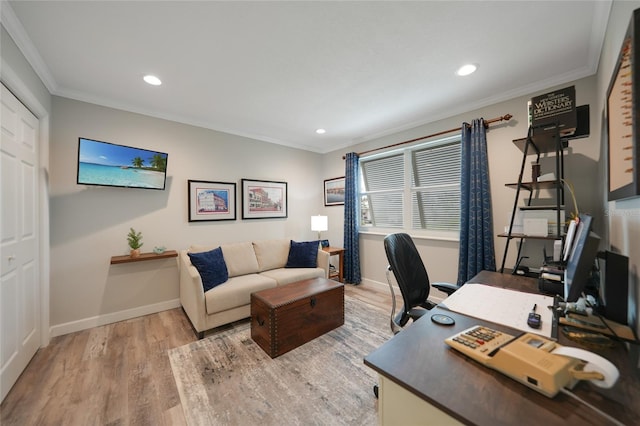 home office with hardwood / wood-style floors and ornamental molding