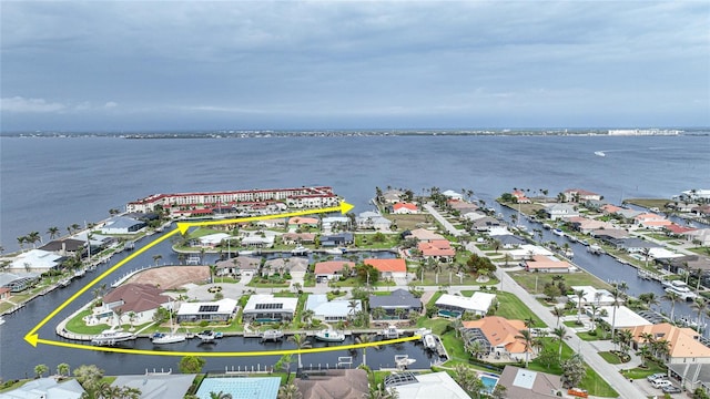 birds eye view of property with a water view