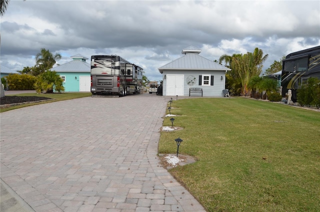 view of side of property with a yard