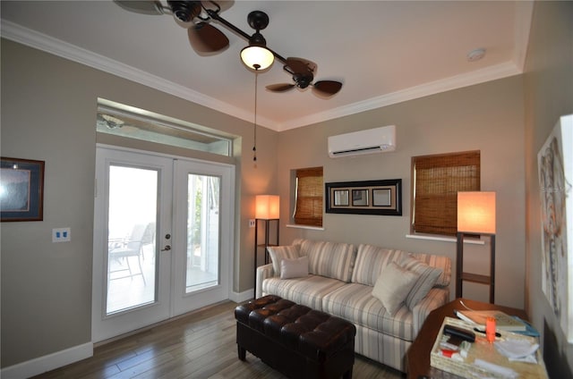 living room featuring ceiling fan, french doors, an AC wall unit, wood-type flooring, and ornamental molding