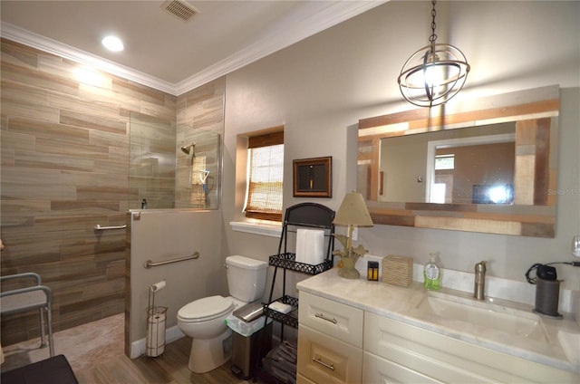 bathroom with a tile shower, hardwood / wood-style flooring, plenty of natural light, and crown molding