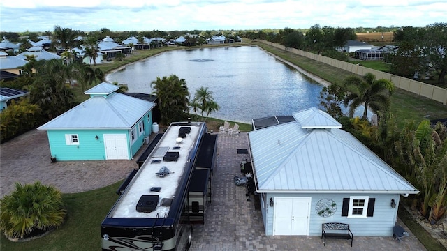 birds eye view of property with a water view