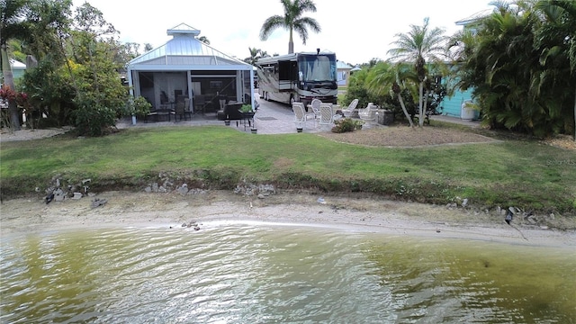 exterior space with a patio area and a water view