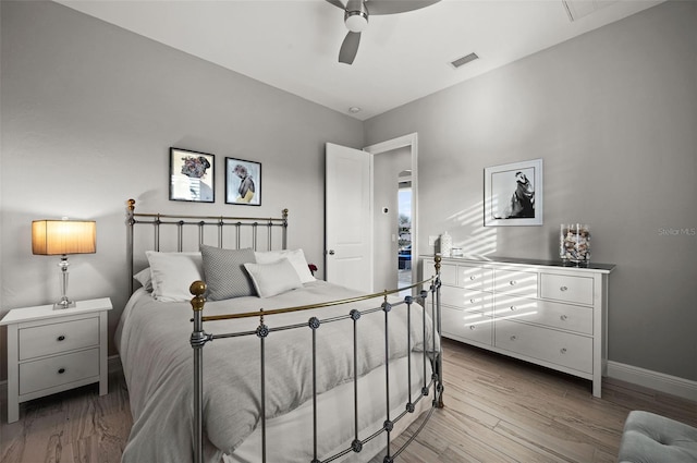 bedroom with ceiling fan and light hardwood / wood-style floors